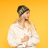 Jacquard beanie with logo mod. 6024 on a model – side view, the sample lettering runs all the way round the beanie